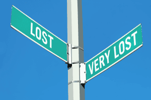 Lost and very lost street signs against a clear blue sky, symbolize confusion and life challenges, perfect for motivational and inspirational content, related to overcoming obstacles.
