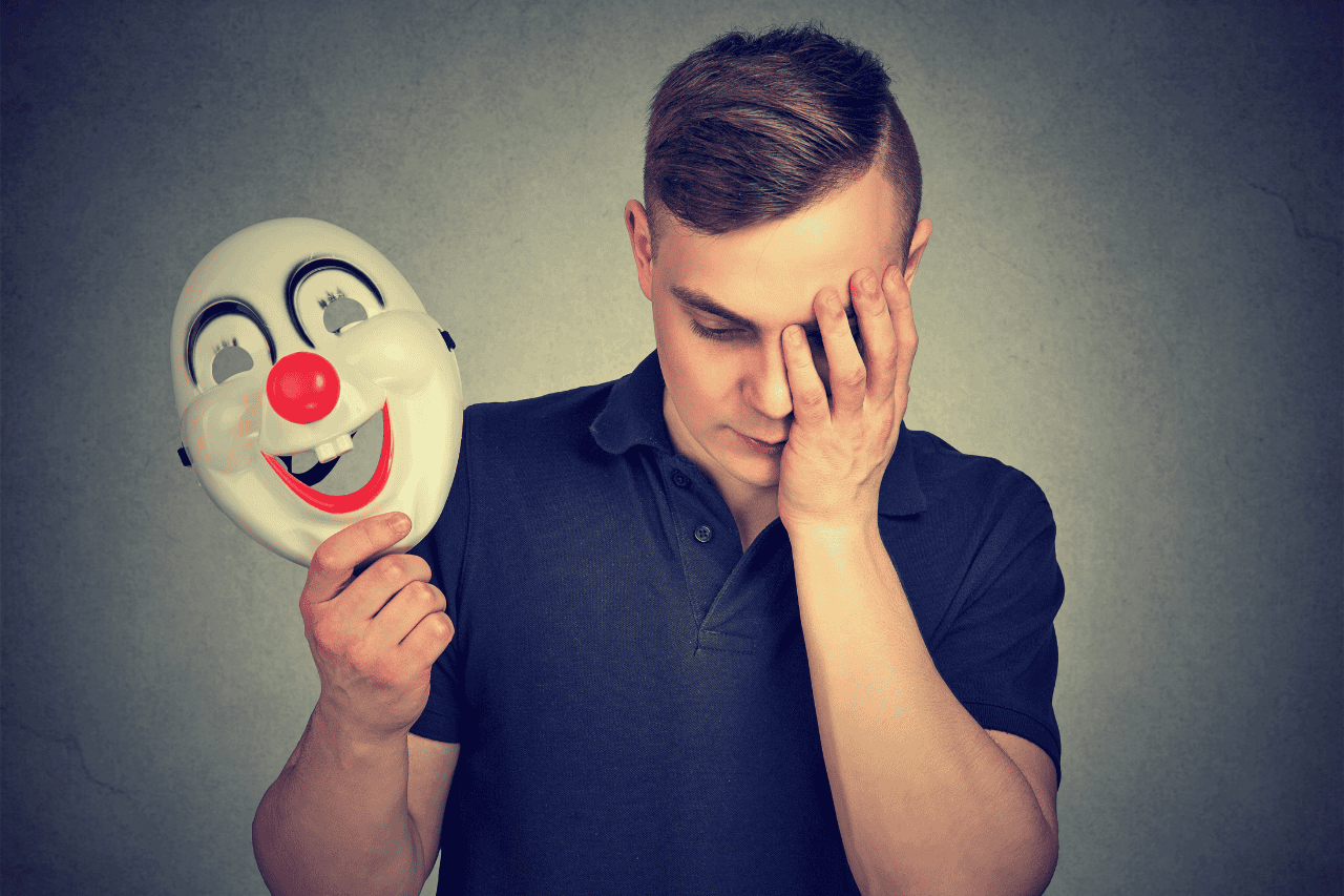 Solemnsir-man-with-clown-mask-depression-stress-anxiety-mental-health-awareness.